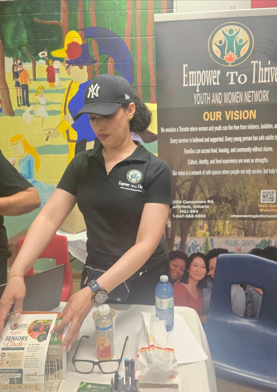 Caroline and outreach team at official Empower To Thrive welcome booth in Toronto