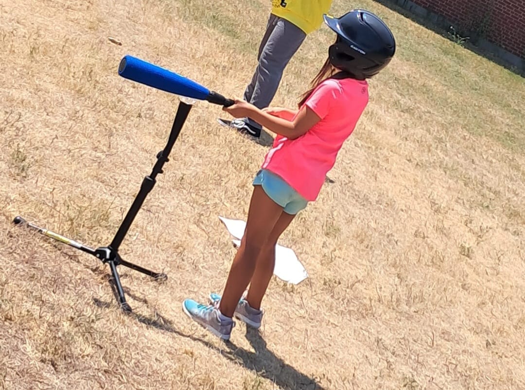 Youth teammates cheering each other on at the plate
