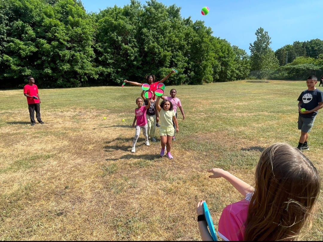 Youth participating in lawn games and physical activities
