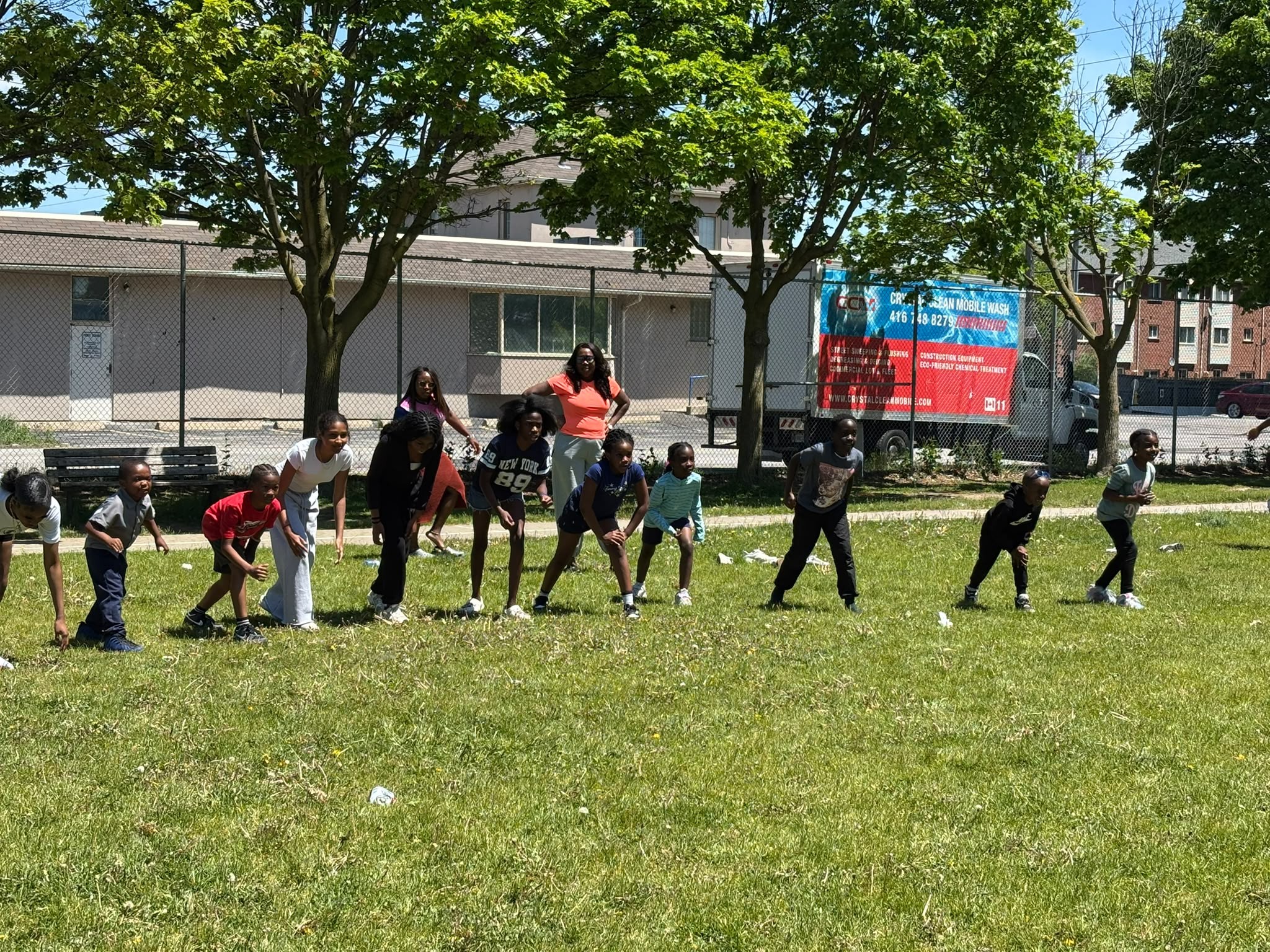 Ready, set, go — youth dash across the green field in Toronto