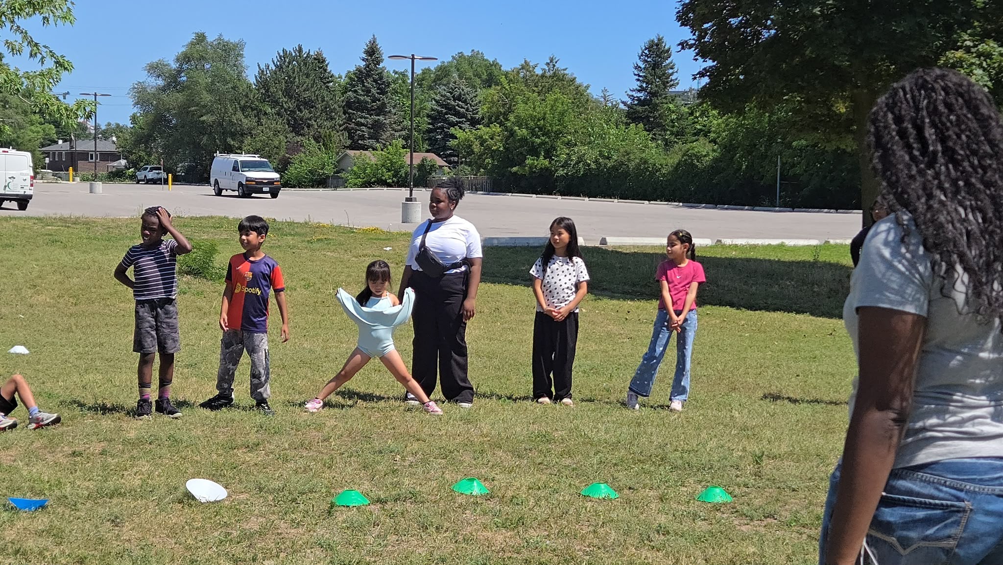 Young children practicing balance and agility with cones in Toronto